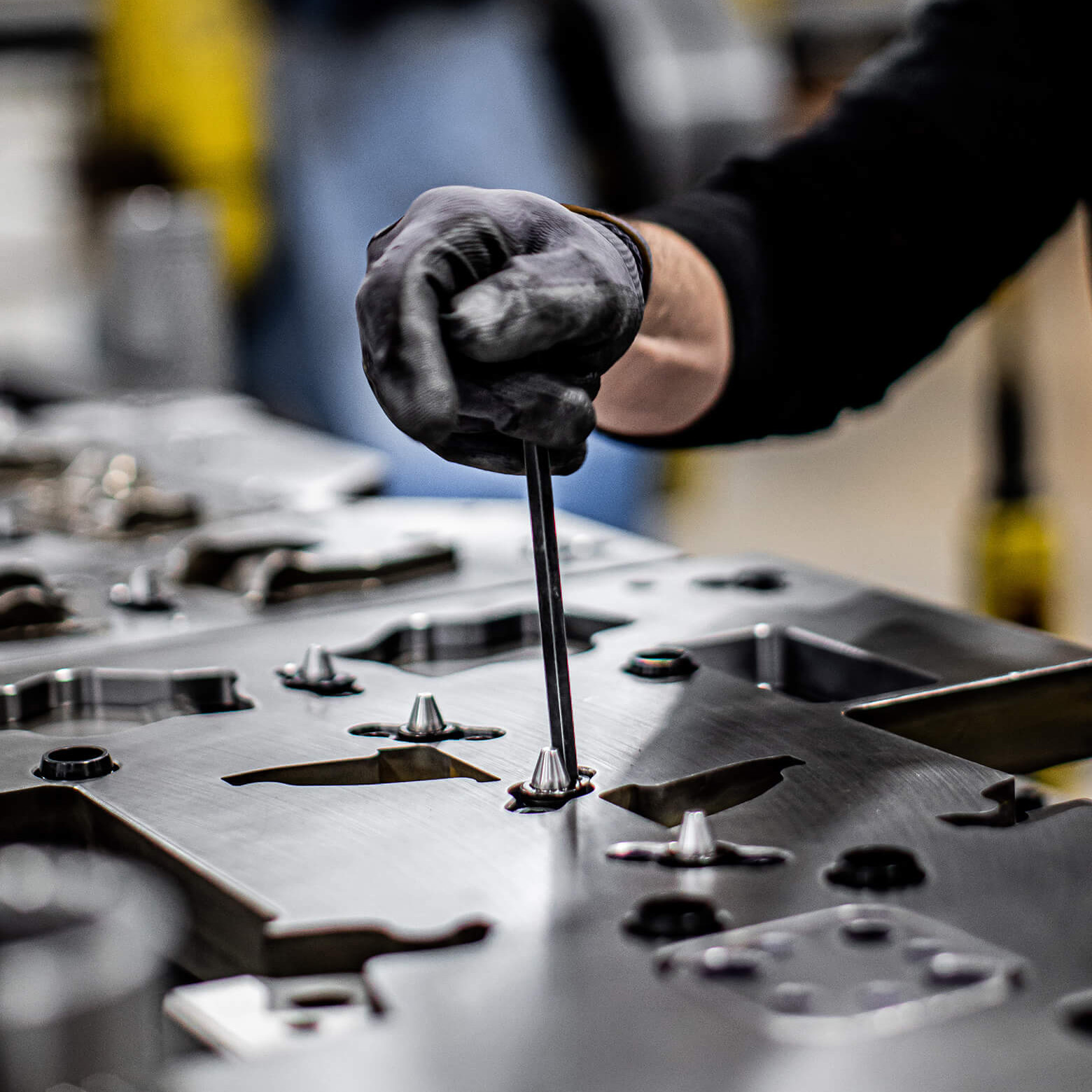 Employee adjusting pilot assemblies